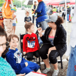 Children getting their faces painted at the 5k festival.