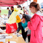 5k runners filling out forms and getting their numbers for the run.