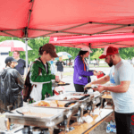 5k festival attendees getting food from the catered buffet.