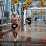 Runners finshing the 5k in the rain.