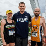 Three 5k runners having their picture taken after the run.